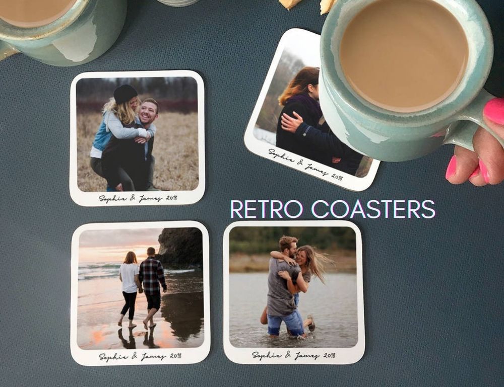 Photo coasters on table with tea cup