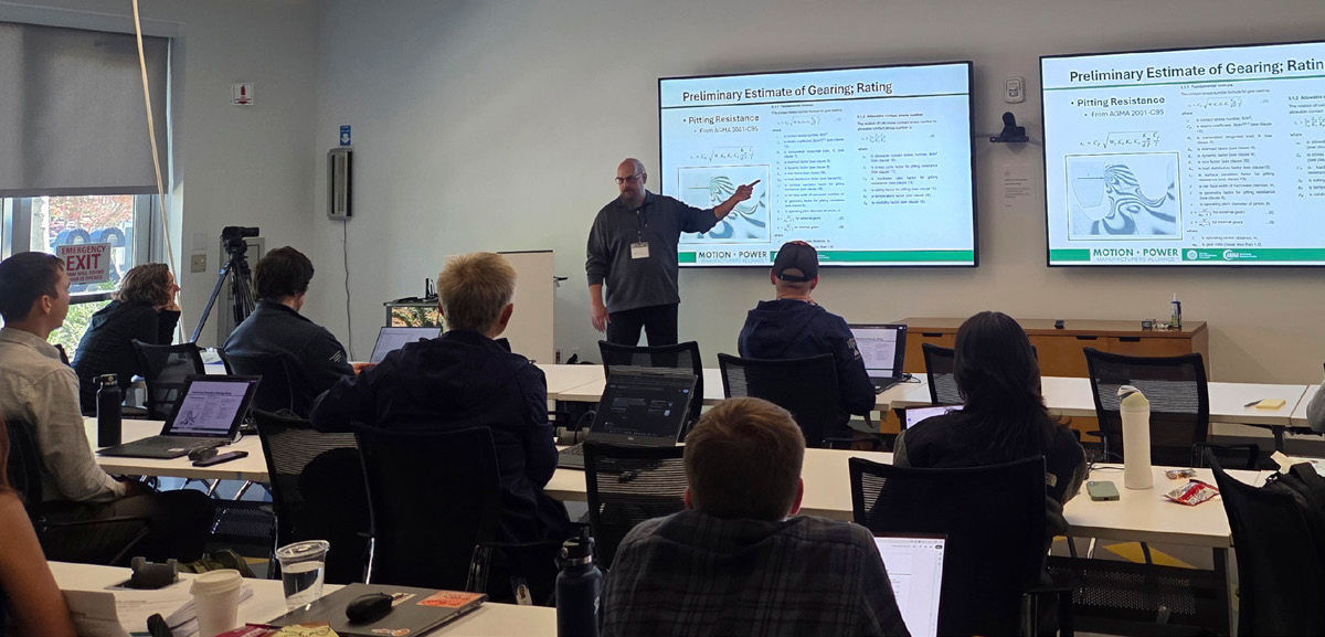 Lance Brown conducting a custom on-site training for a group of robotics engineers.