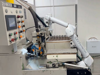 An OB7 Stretch alongside the Mikron A33/0 hobbing machine.