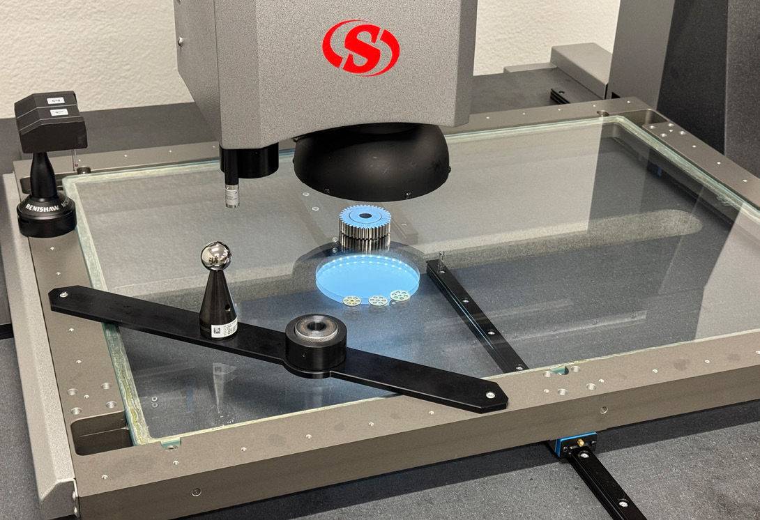 Close-up of spur gear under high-resolution camera. Vision-based edge detection rapidly captures critical geometric features without physical contact. (Courtesy of Starrett Metrology Systems Division.)