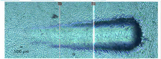 Figure 11—Image of ASTM C1624 Scratch Test results on P51M Coating. For this test, LC1 was detected at 33.3 N, LC2 was detected at 63.27 N, and no occurrence of LC3 was detected.