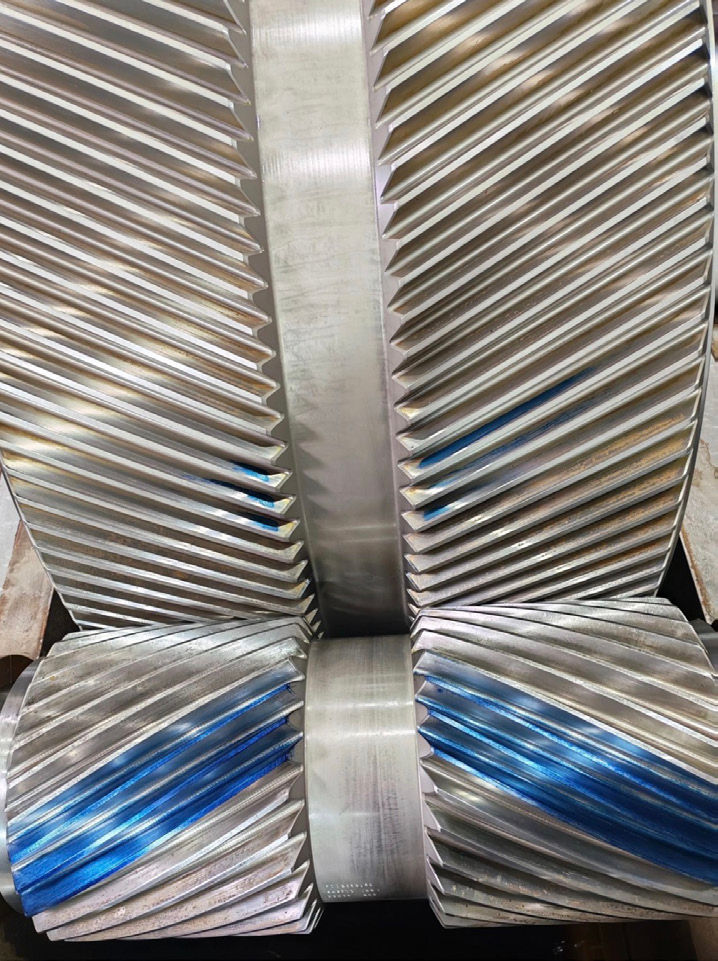 Figure 2 — Contact pattern verification on helical gear teeth. Blue marking compound highlights the actual contact area across the tooth flank. Uneven patterns may indicate edge loading, alignment deviation, or load distribution issues before visible gear damage occurs.