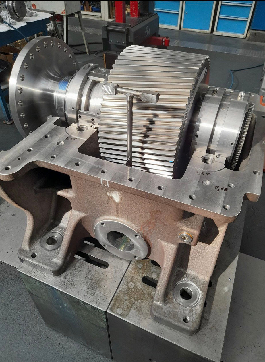 Figure 3 — Gearbox assembly under inspection. Heavy-duty gear and shaft assembly during fitting and inspection. Long-term reliability depends on evaluating the complete system rather than replacing the gear alone.