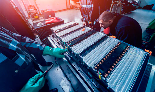 Disassembling the battery of an electric vehicle engine (courtesy Adobe Stock/romaset).