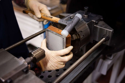 Each filtration sieve is carefully assembled to support reliable propellent management in space. (Image: John Crane)