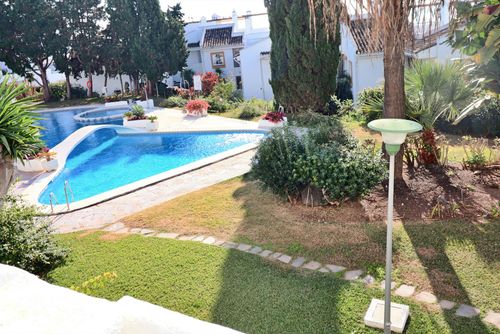 Apartment Atalaya 2 Bedroom  IHAA1100120: Benalmádena, Andalusia, Spain. Garden and swimming pool and Communal swimming pool