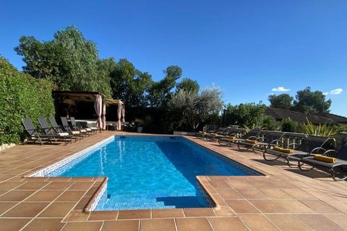 At 15 minutes drive from Sitges. Villa Ilusión   Pool XXL   Villa muy comoda  para grandes grupos Area muy tranquila   Muy cuidada Villa in Sitges, Costa Dorada, Spain with private pool for 16 persons. The house is situated in a hilly, wooded, and residential beach area....