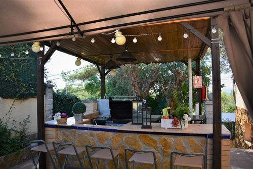 At 15 minutes drive from Sitges. Villa Ilusión   Pool XXL   Villa muy comoda  para grandes grupos Area muy tranquila   Muy cuidada Villa in Sitges, Costa Dorada, Spain with private pool for 16 persons. The house is situated in a hilly, wooded, and residential beach area....