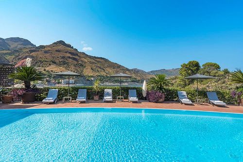 Villa Tao Bay Villa with private pool in Taormina, Sicily, Italy for 12 persons. The house is situated in a residential beach area and is 25 m from the beach....