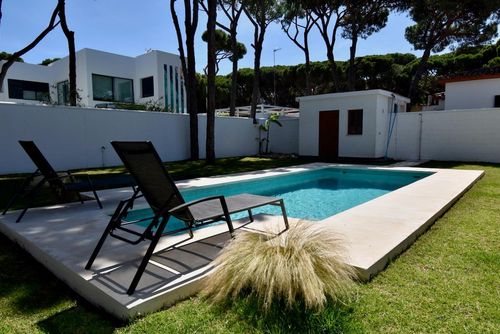 The Coach House Modern and comfortable villa in Chiclana de la Frontera, Costa de la Luz, Spain with a private pool for 6 persons. The house is situated in a residential beach area, close to restaurants and bars, shops and supermarkets, 500 m from La Barrosa beach and 0....