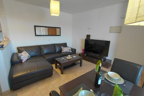 Apartamento Casa Rumah Kita: Aguilas, Murcia, España. Sala de estar, Aire acondicionado y televisión