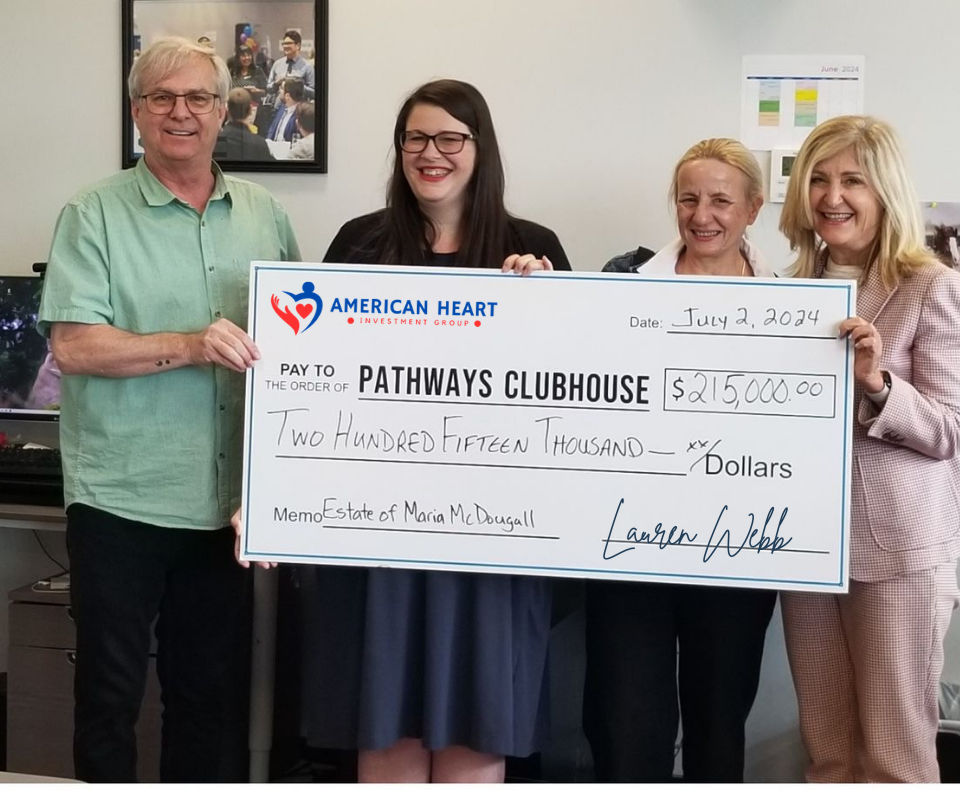 Grant winner holding a check