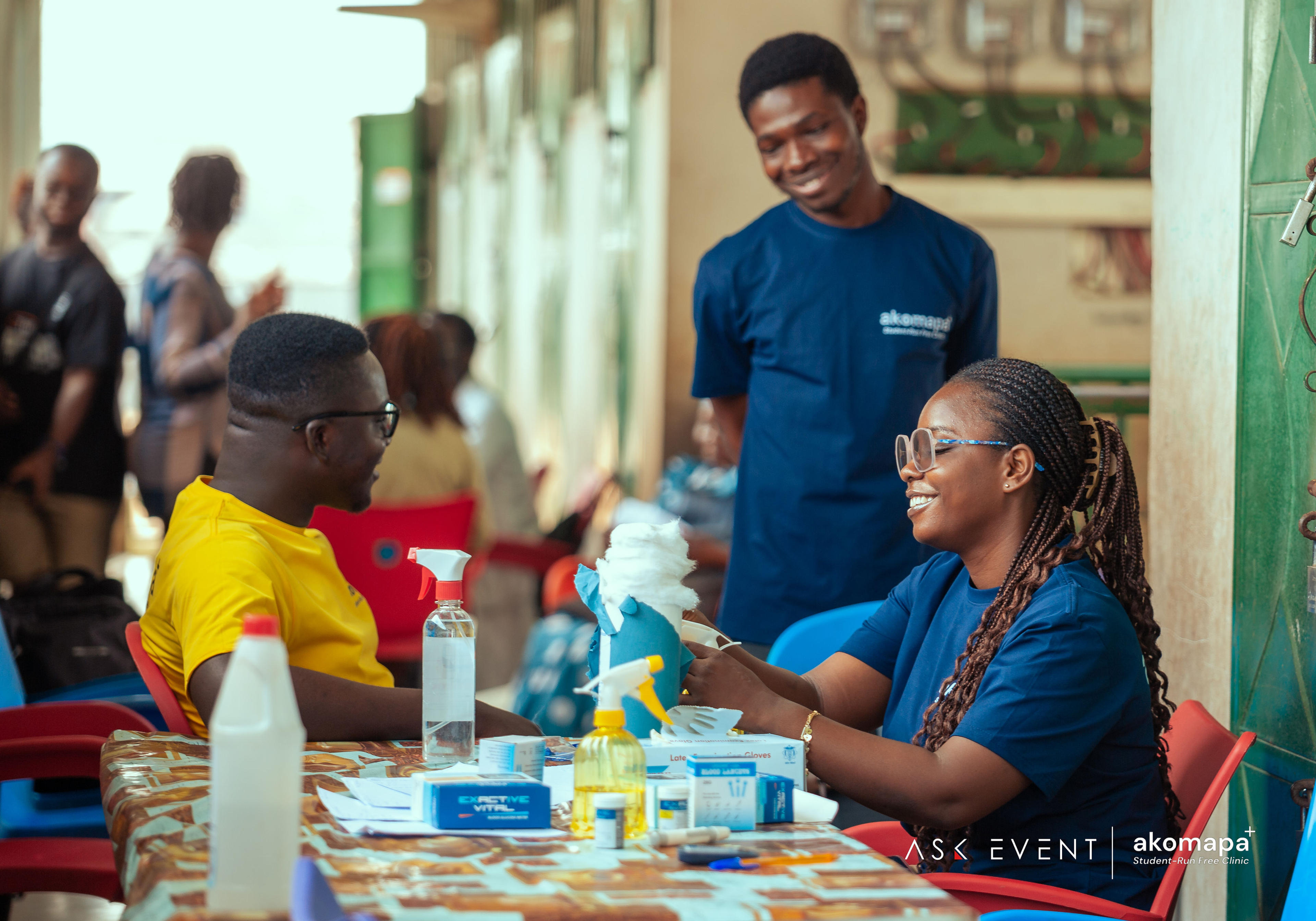 Akomapa partners and student leaders standing together after community work