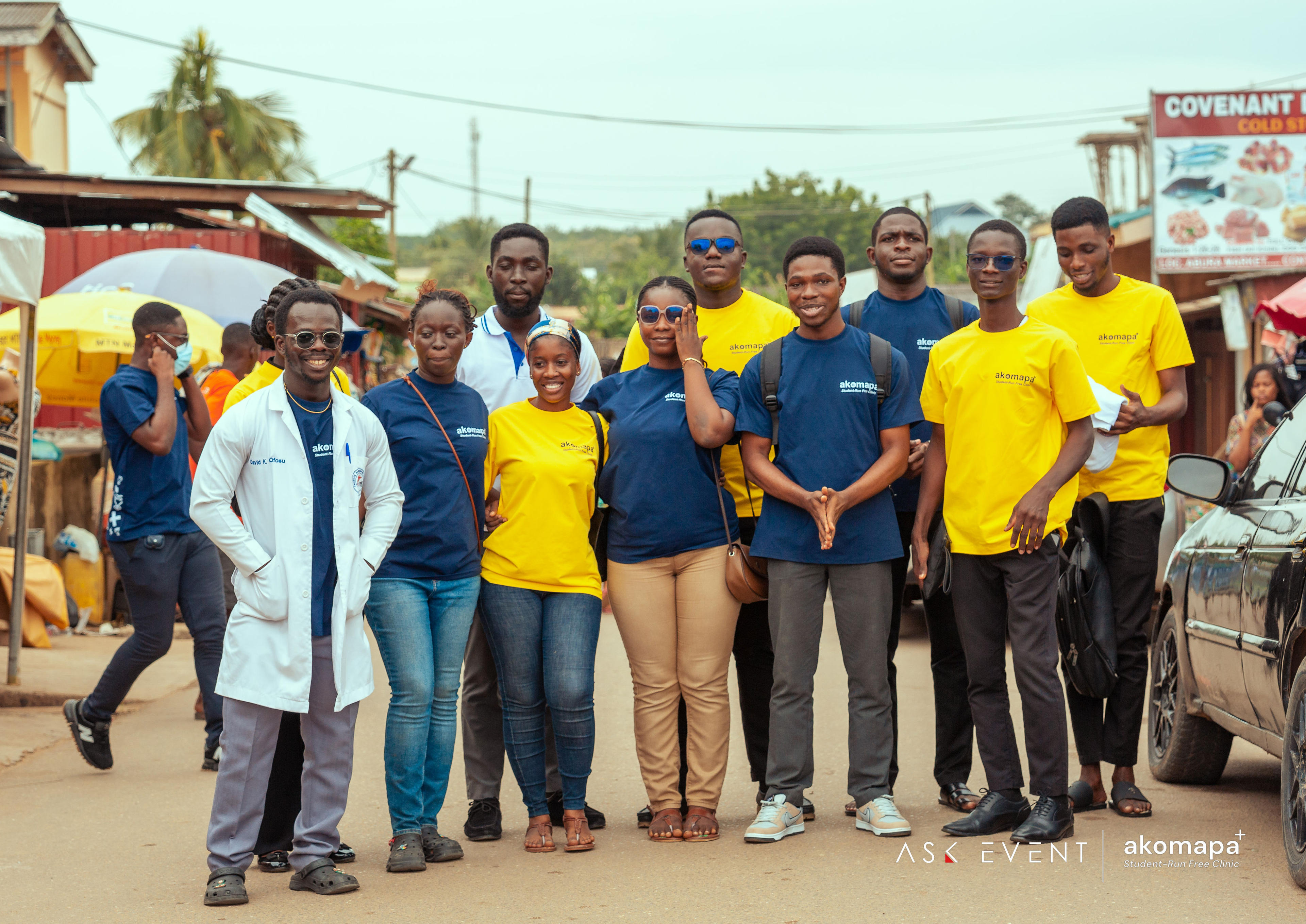 Akomapa students and faculty reviewing community health research together