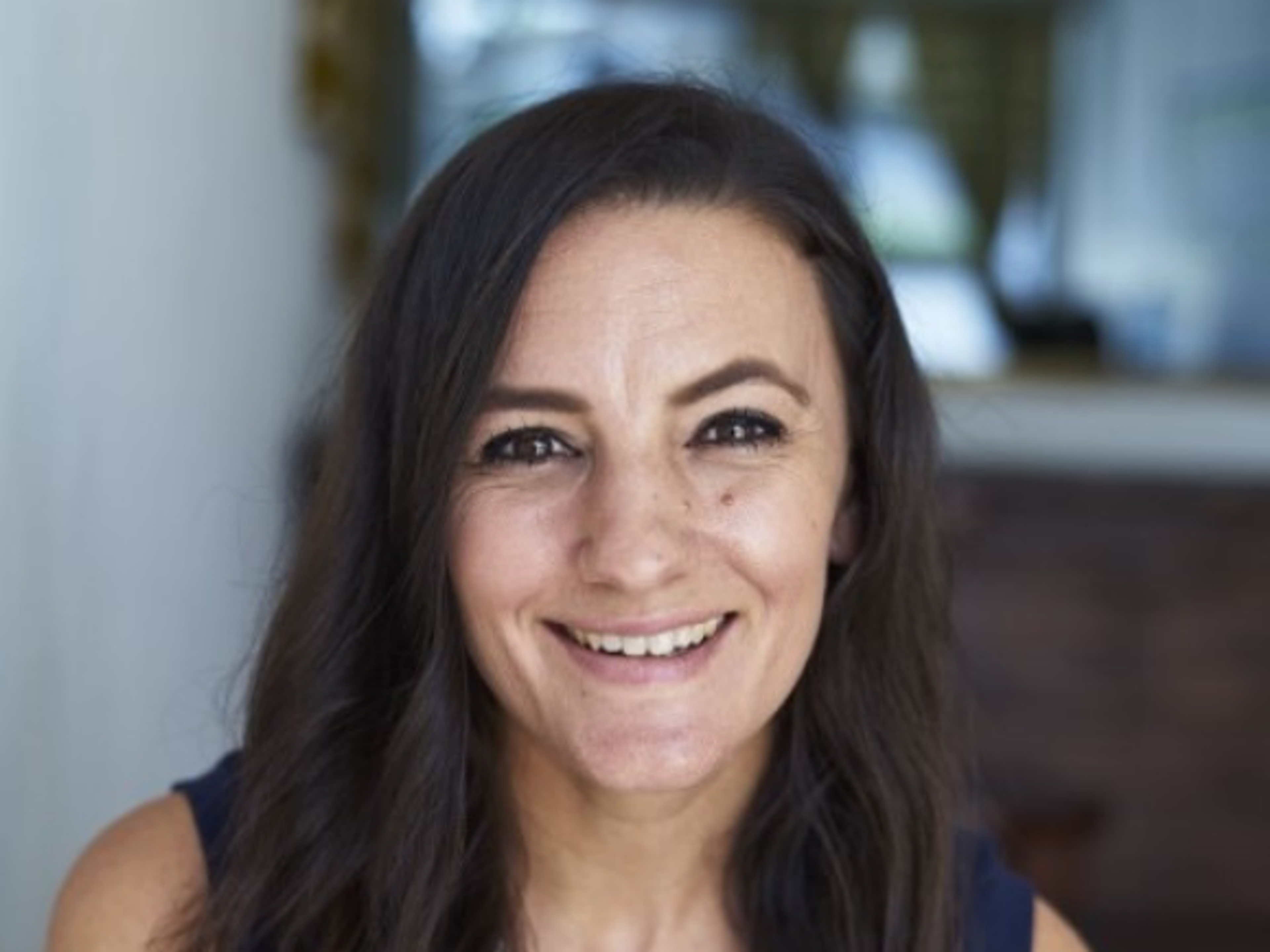 Headshot of Emily Sheldon, Co-Founder