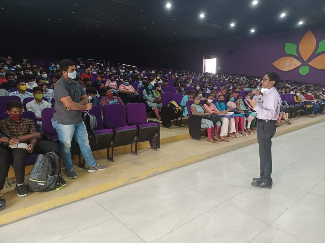 parent and teenage student discussing career plans with laptop and roadmap on table, warm lighting, professional photography