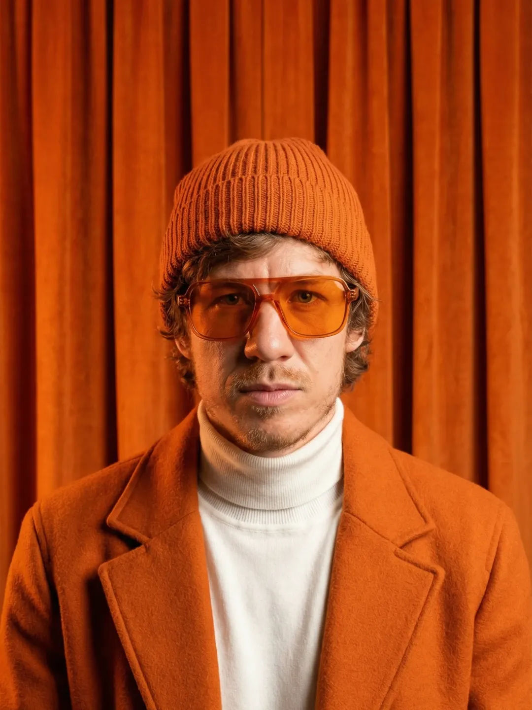 Monochromatic Orange Portrait Prompt – Fashion Editorial with Beanie and Sunglasses — Portrait AI art prompt example for Midjourney and Stable Diffusion