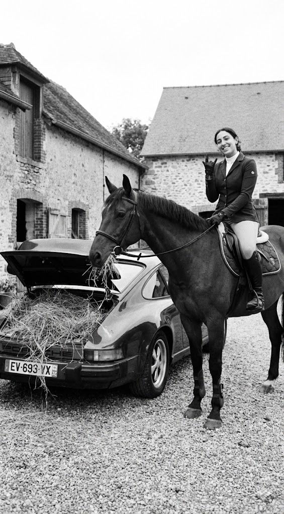 Surreal Black and White Lifestyle Prompt – Horse Eating Hay from Porsche 911 — Portrait AI art prompt example for Midjourney and Stable Diffusion