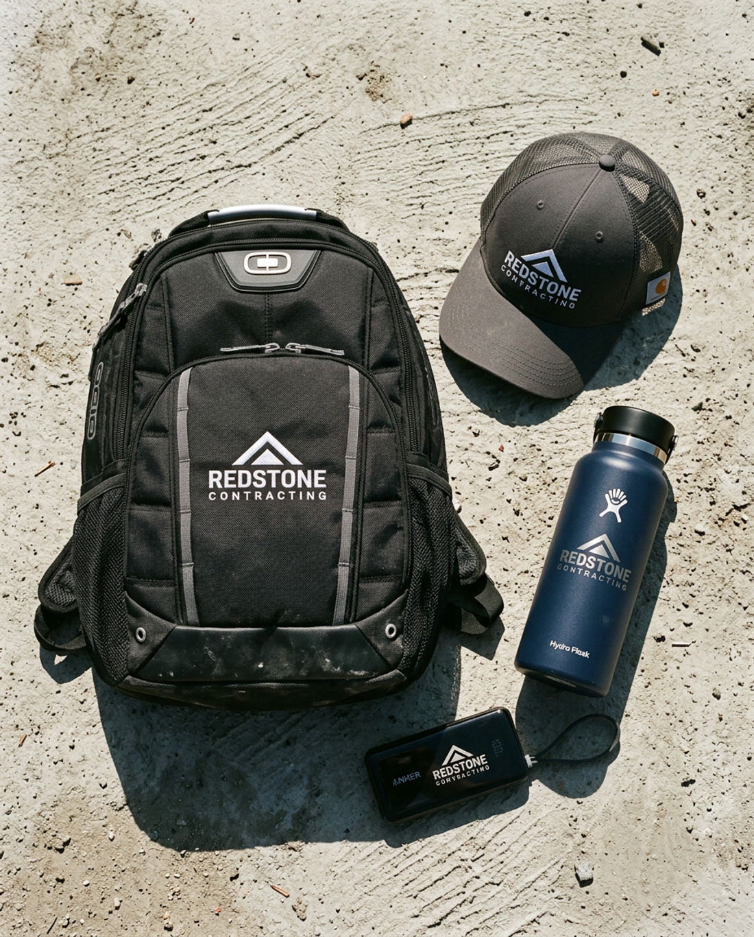 Construction Crew Plus gift kit with embroidered OGIO Bolt Pack, Carhartt cap, engraved Hydro Flask, and Anker power bank