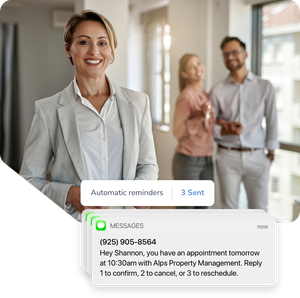 A real estate agent smiles with her happy clients. An appointment reminder informs her clients of their upcoming appointment.