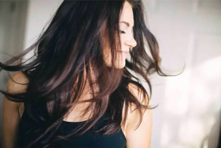 Woman displaying haircut by M Scott salon