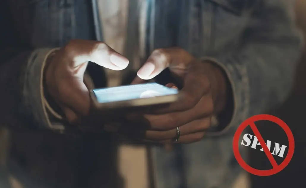 Person on cell phone with no spam warning label