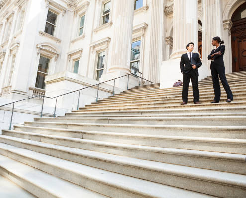 Lawyer and client outside courthouse