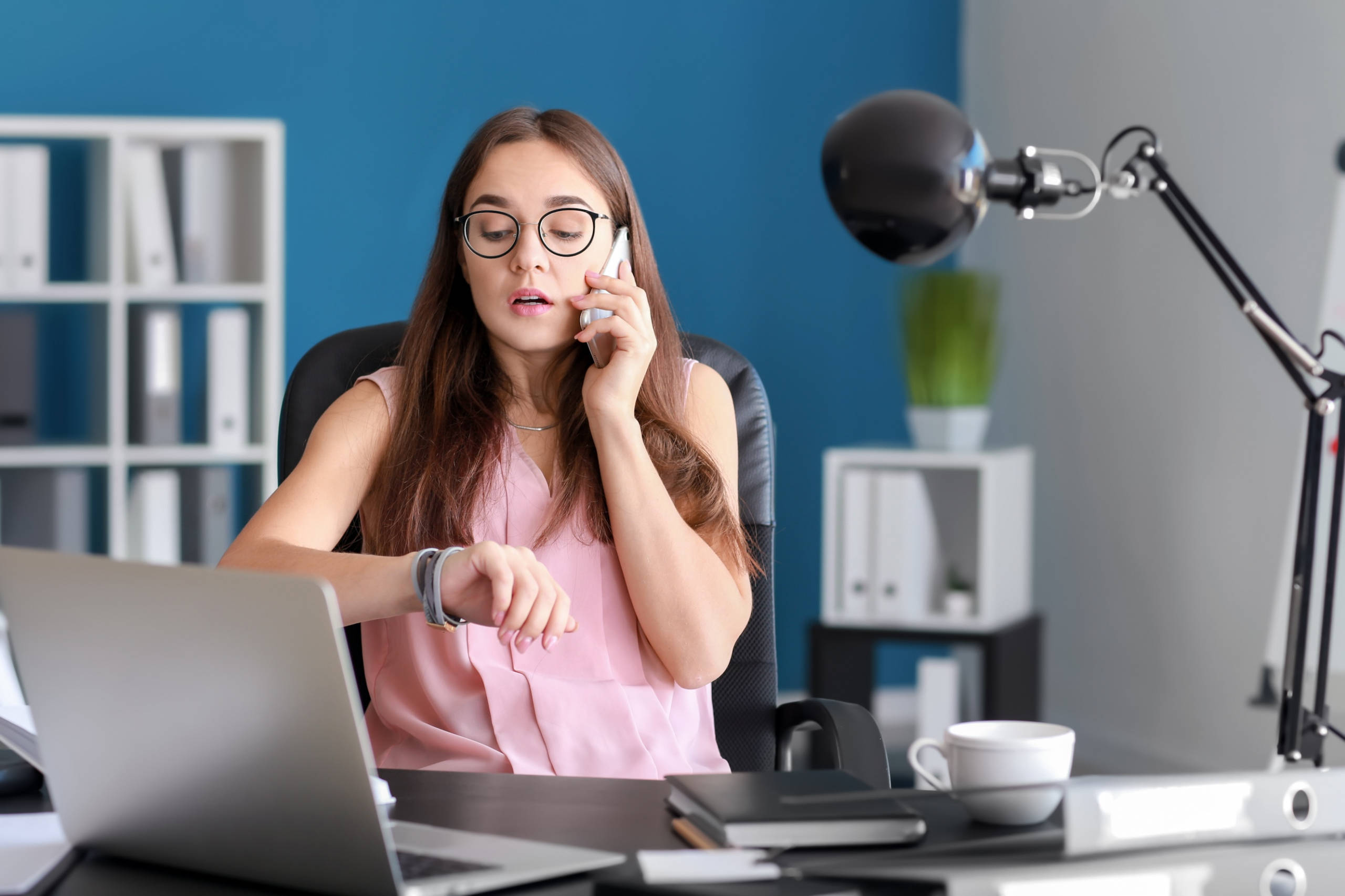 Businesswoman calling client who is late or no-showing their appointment