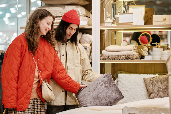 A couple shopping for bedding