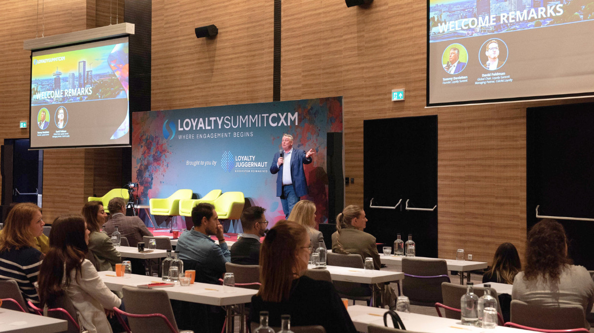 A speaker presenting at Loyalty Summit CXM Amsterdam 2026