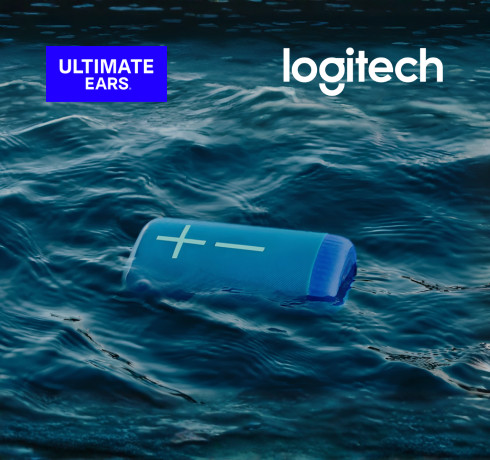 Blue Logitech portable speaker floating in ocean water with the message “Get More. Boom.” and Ultimate Ears branding.