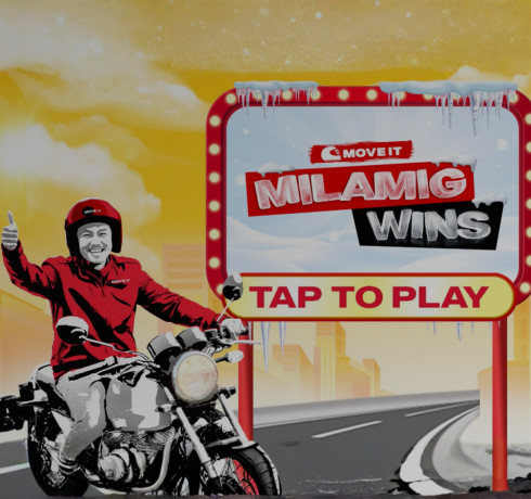 A man sitting on a motorcycle, next to a sign that says "MILAMIG WINS" and "TAP TO PLAY"