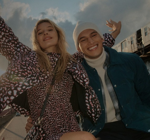 The Tommy Hilfiger campaign page on a laptop screen