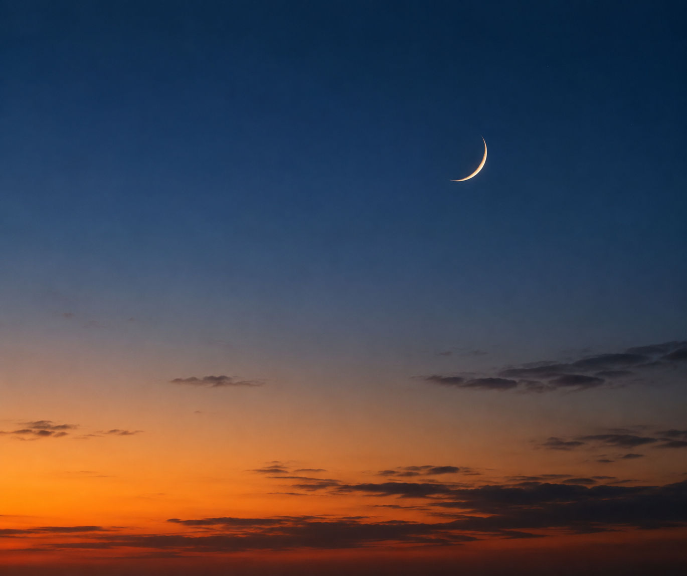 Crescent moon in evening sky