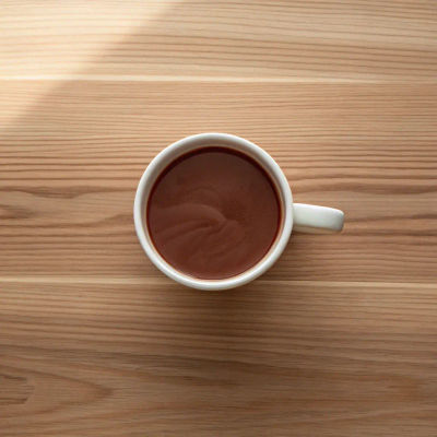 Rich and creamy hot chocolate in a white mug.