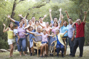 Portrait of a three generation family waving