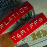 How to Travel Smart in a High-Tariff World Red Tariffs and Inflation labels on a hundred dollar bill