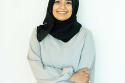 Atteline PR Dubai - Jinaan Hameer posting while standing in a gallery