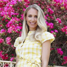 Atteline PR Dubai - Sophie posting with a flowers behind her