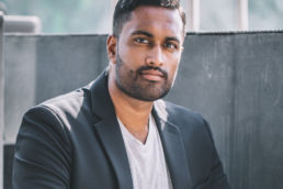 Atteline PR Dubai - Aaron Illathu sitting outside the balcony for his blog