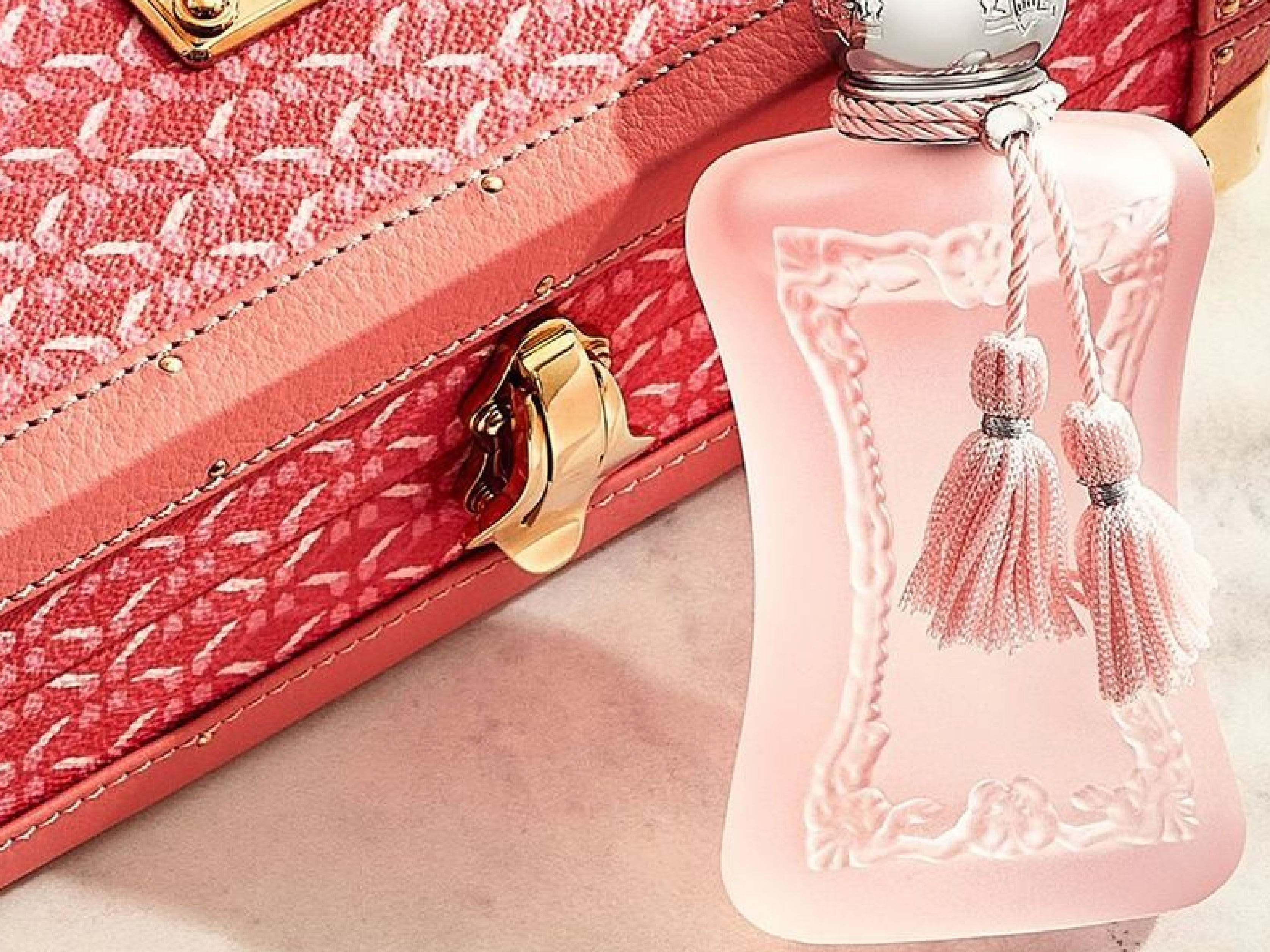 Atteline PR - Parfums De Marly pink Perfume with a suit case