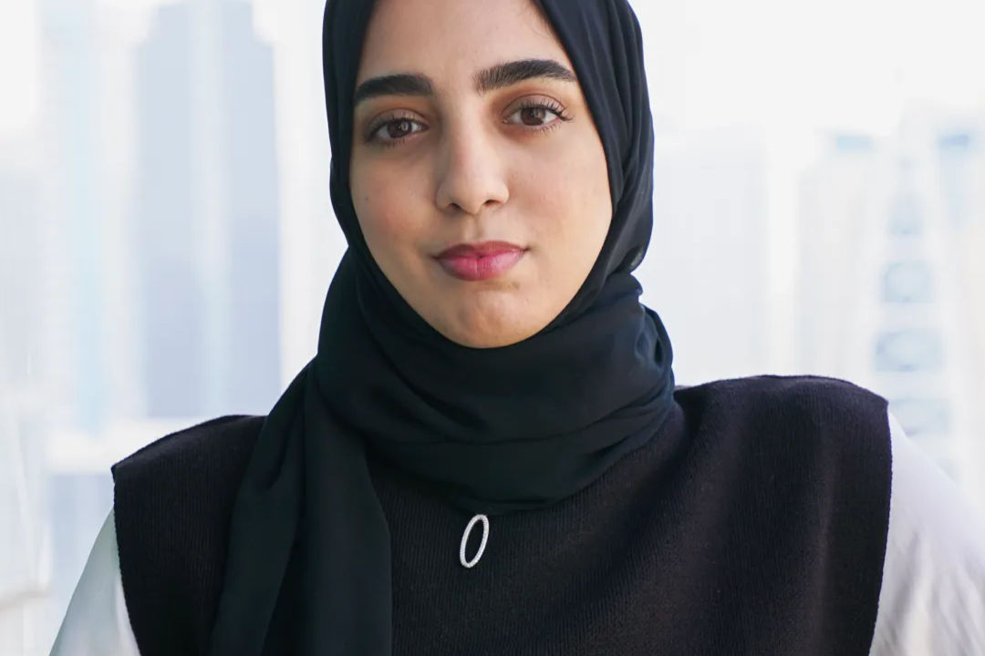 Sarah wearing a hajib on the office terrace