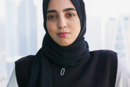 Sarah wearing a hajib on the office terrace