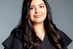 Ruder Finn Atteline Lavina wearing a black dress