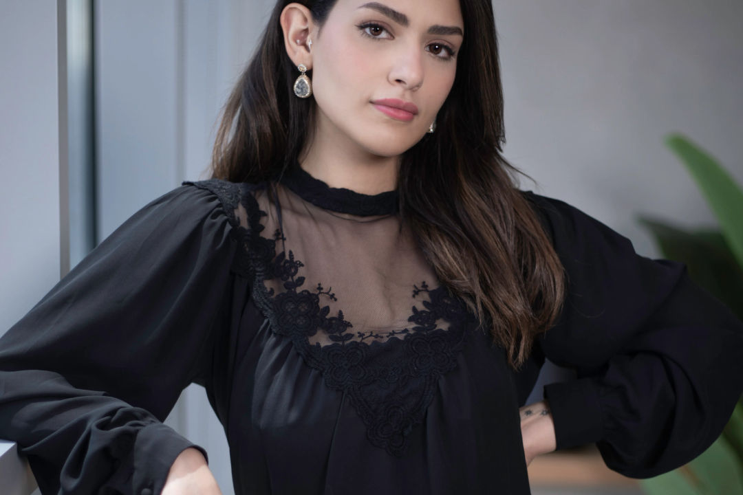 Ruder Finn Atteline Amira posing in front of the camera