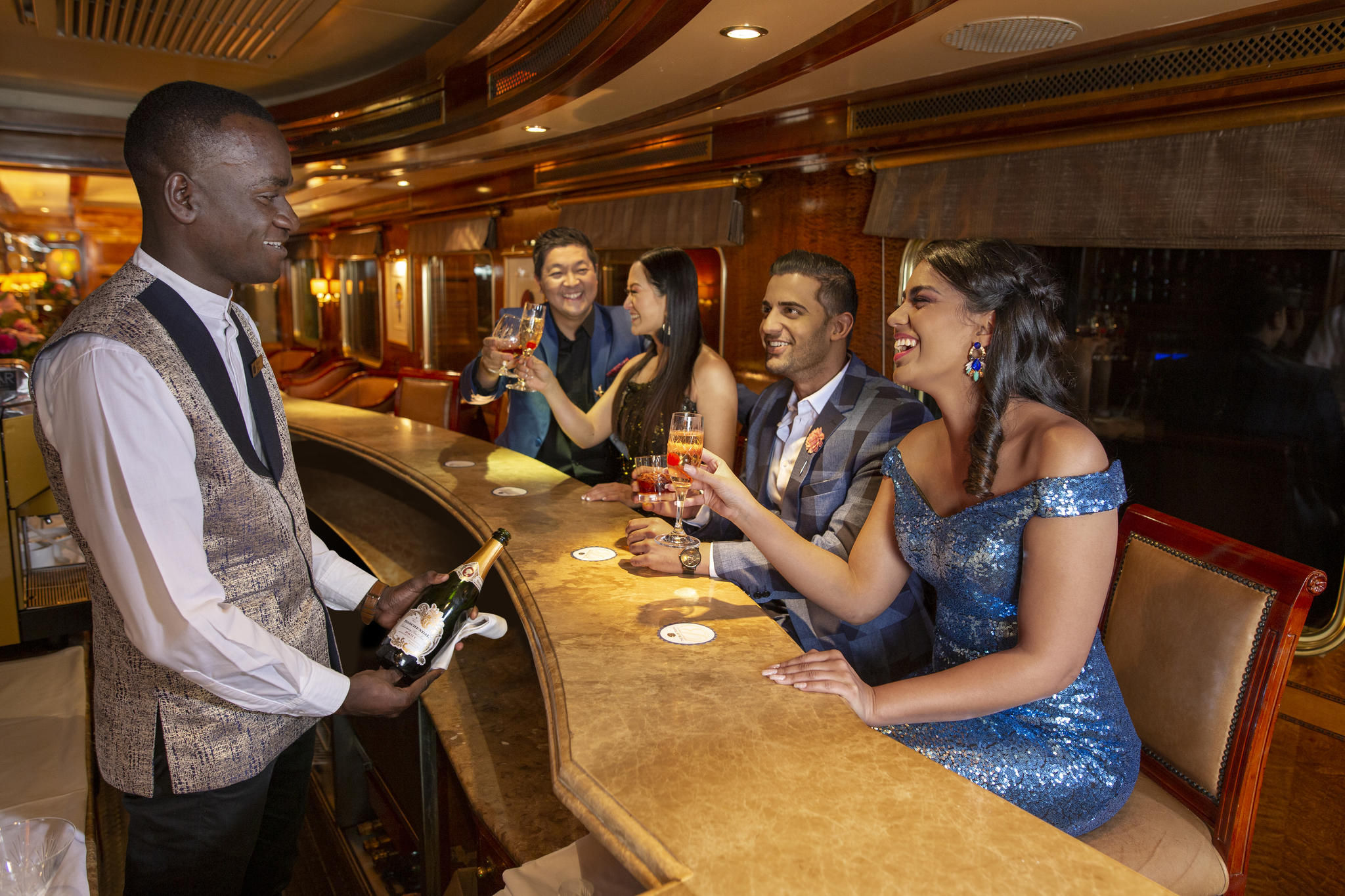 Guests being served drinks in Club Car