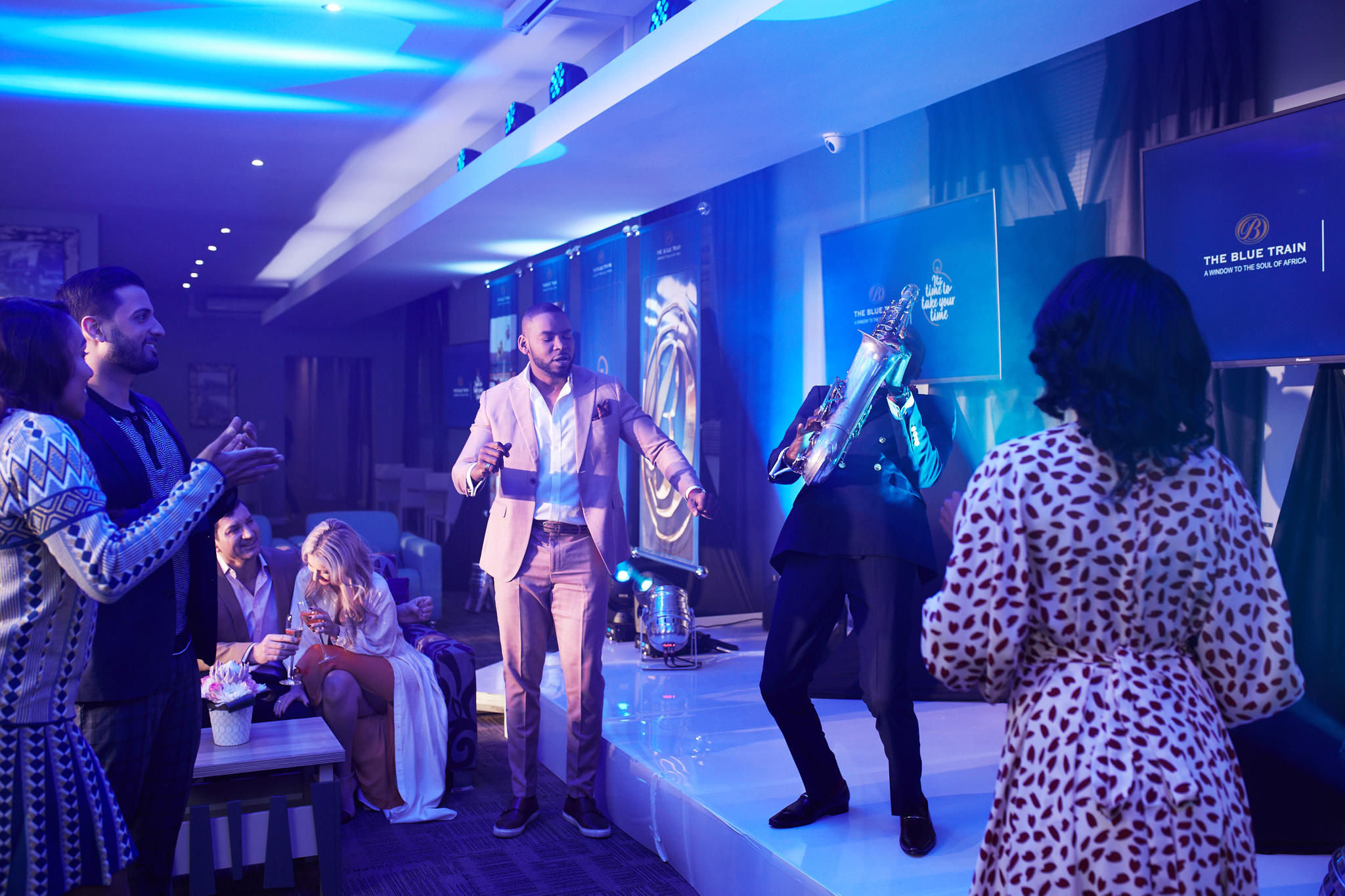 Guests enjoying entertainment  at VIP pre-departure lounge
