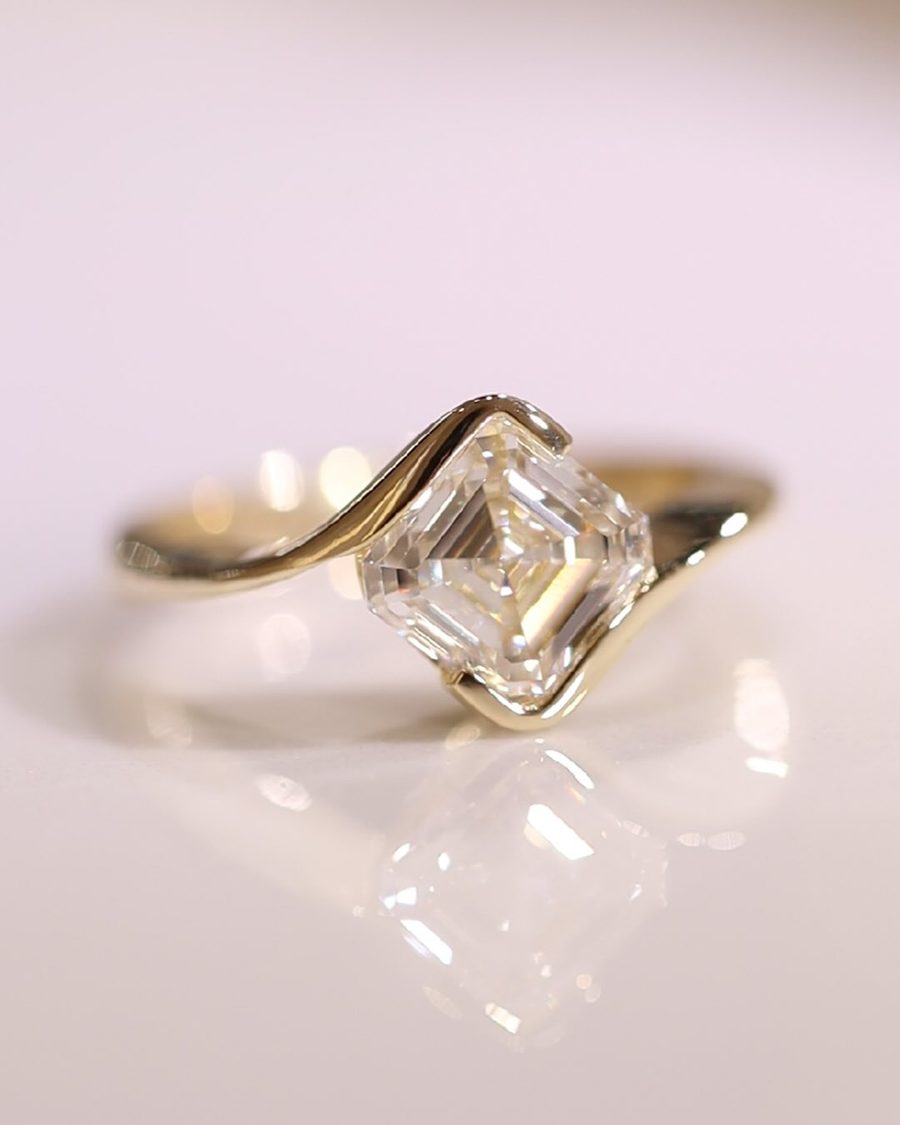 Step cut oval engagement ring