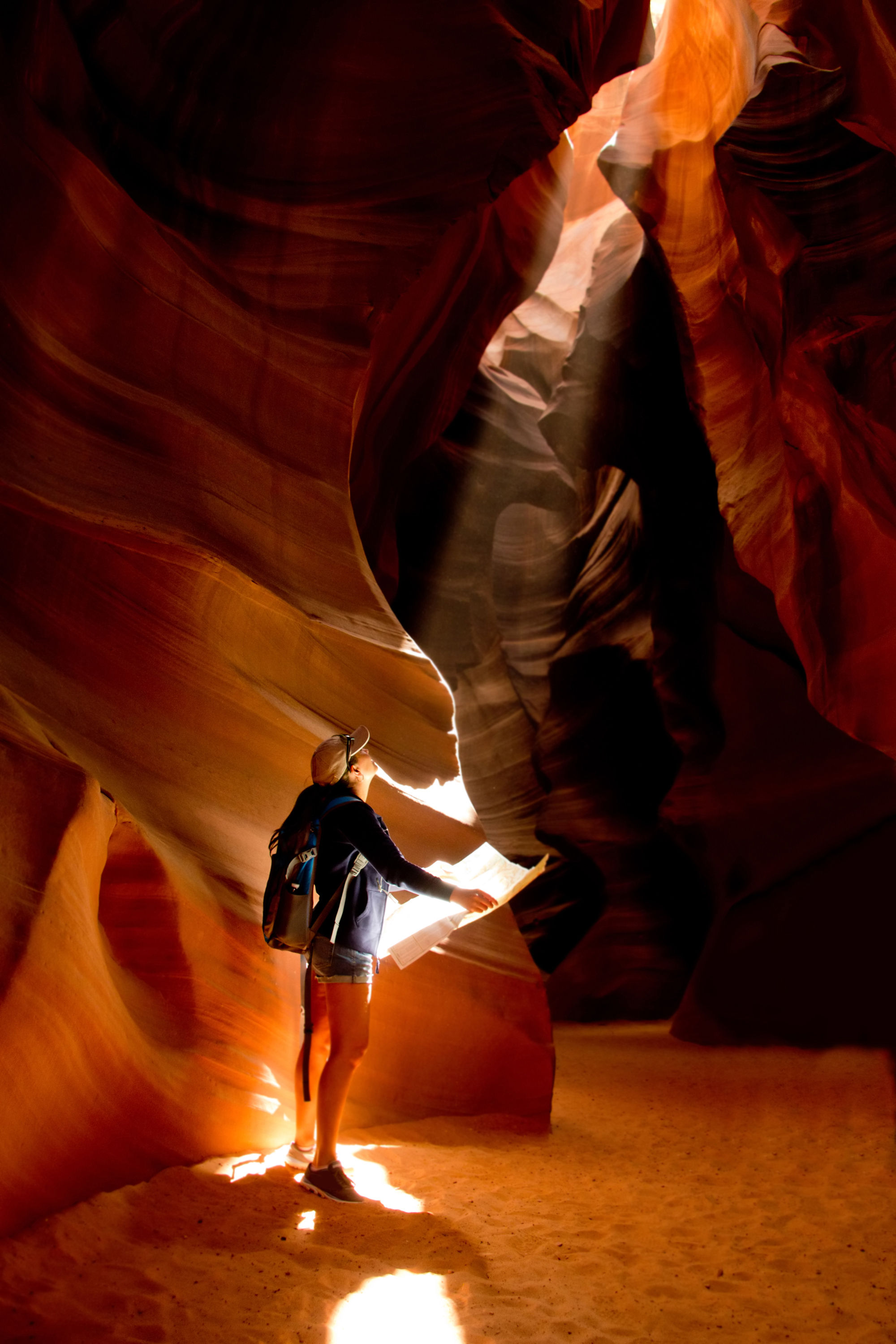 ESTA in the USA Woman in a canyon carrying a map