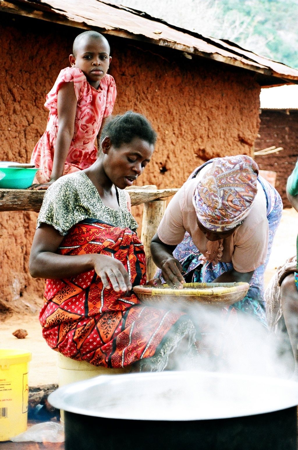 locals cooking when you travel in Africa